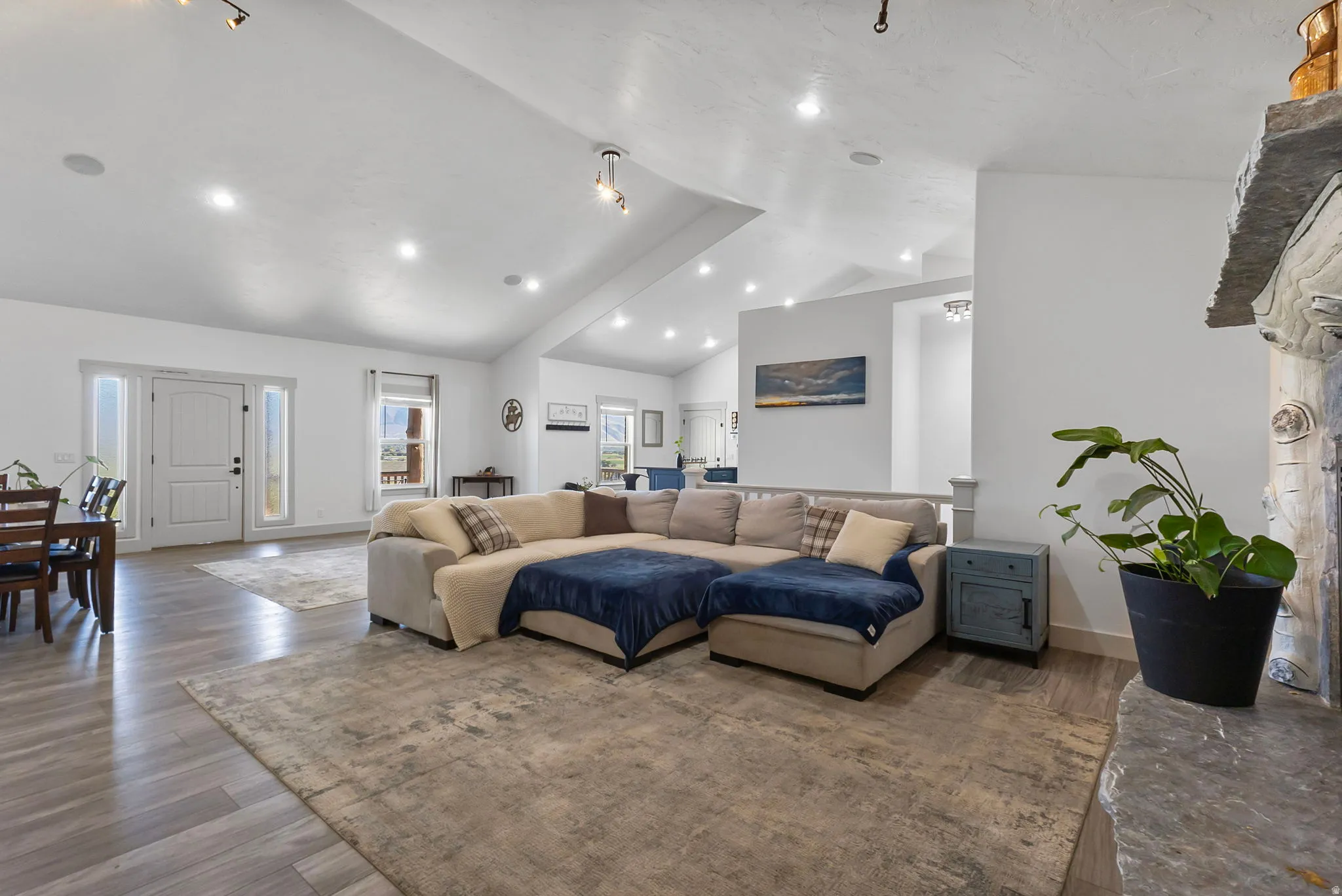 Living room with, recessed lighting, and high vaulted ceiling