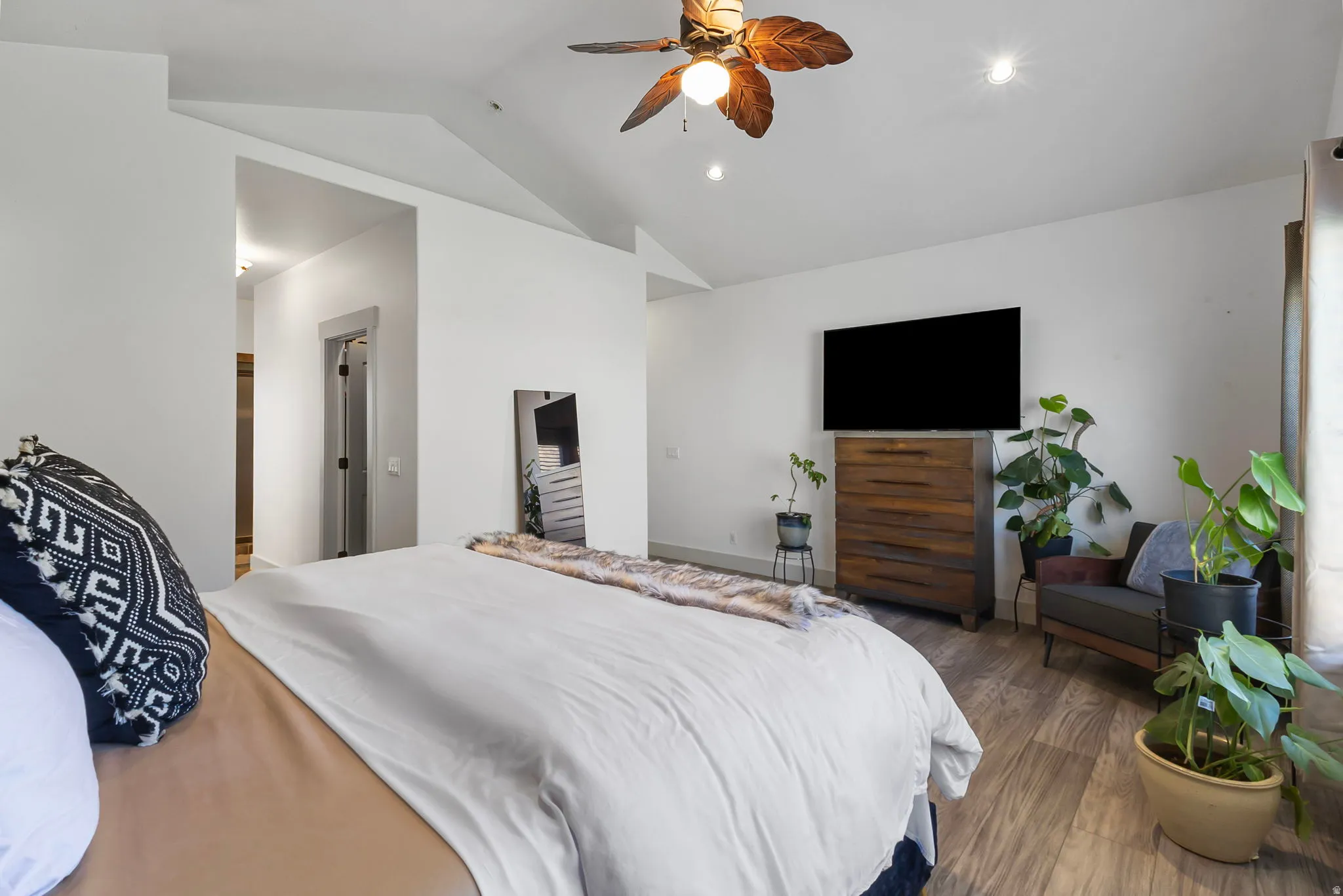 Primary Bedroom featuring vaulted ceiling, a ceiling fan, and recessed lighting