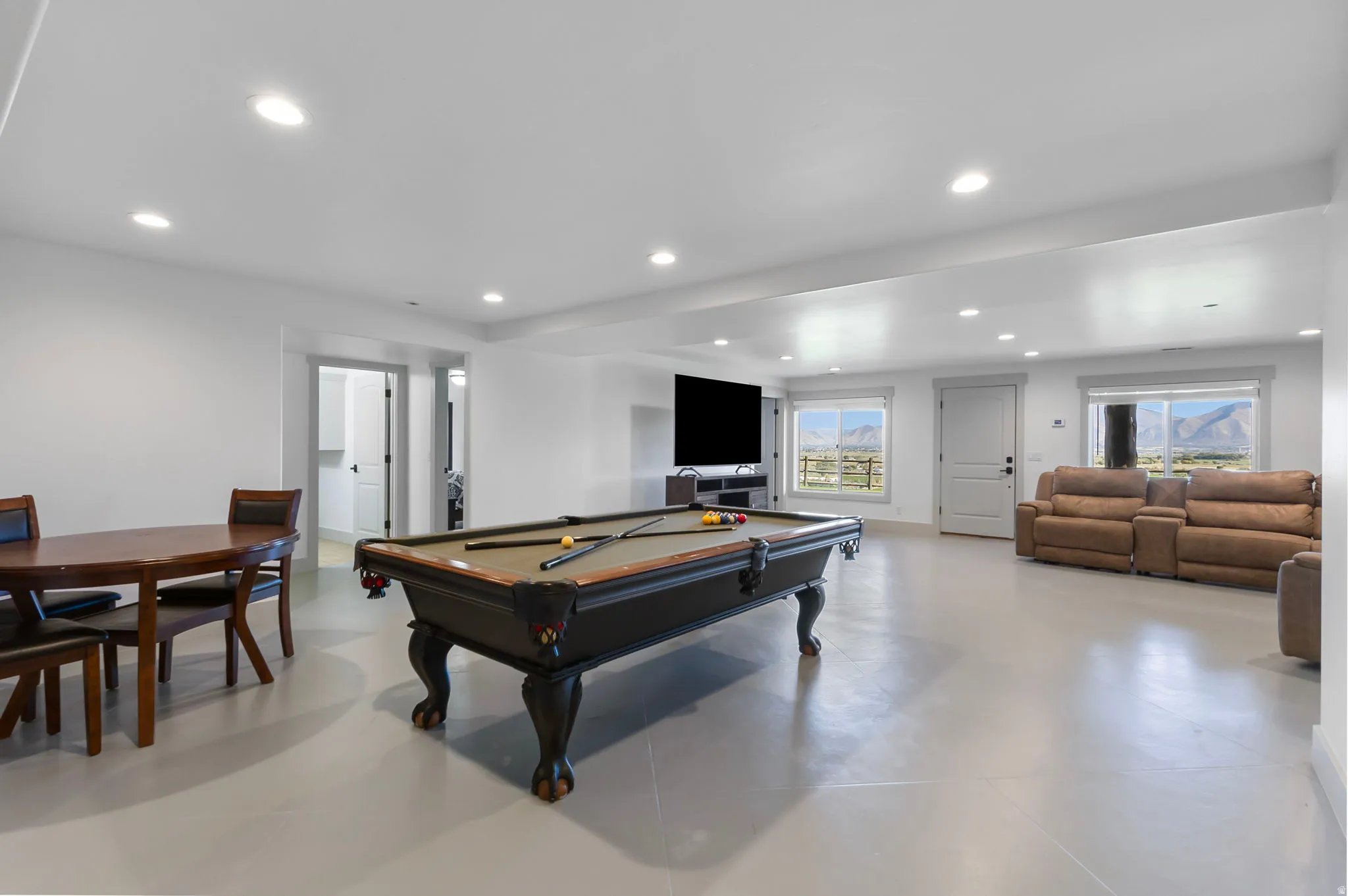 Recreation room featuring a stone fireplace, billiards, and recessed lighting