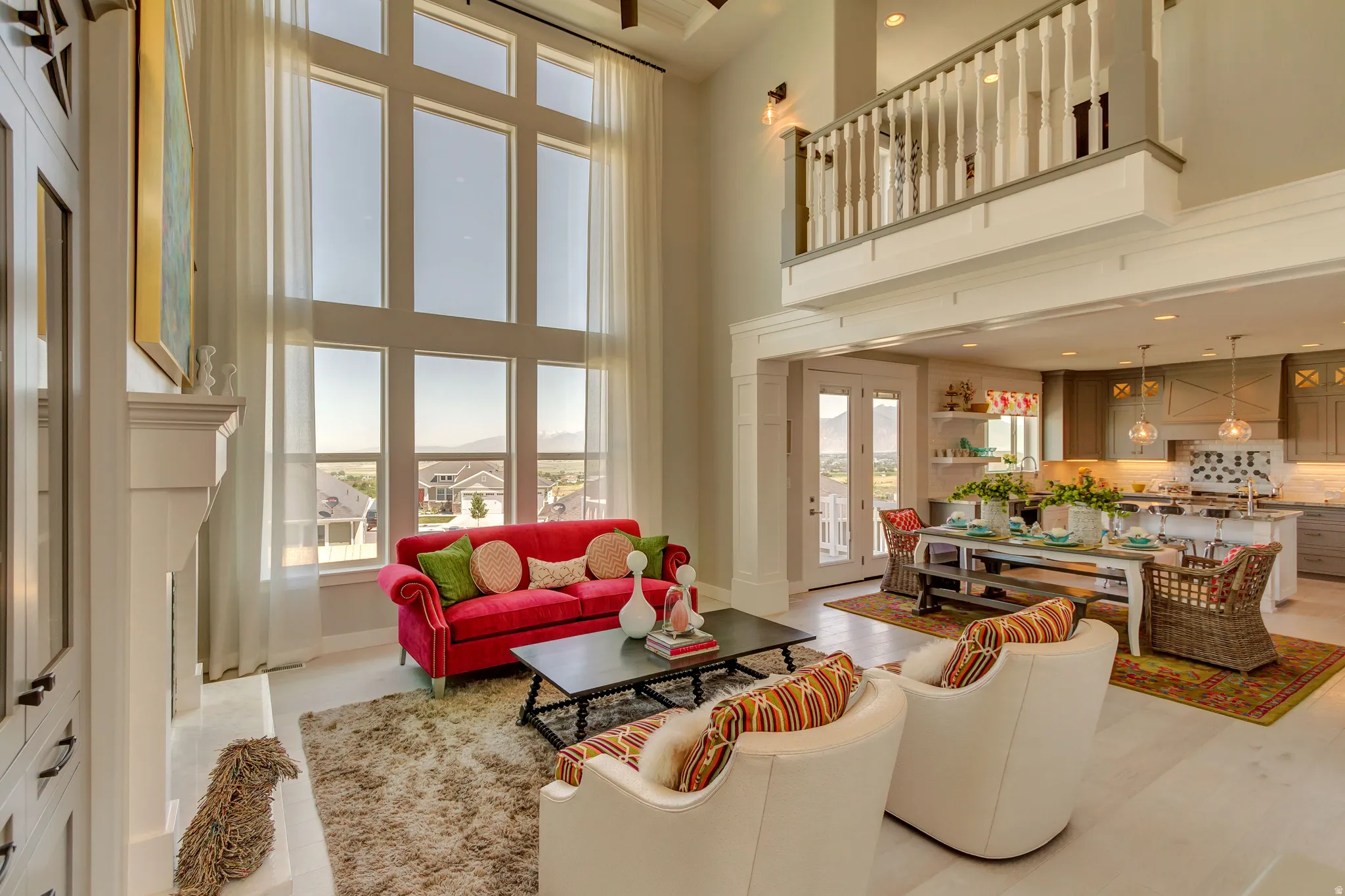 Living room featuring recessed lighting, a high ceiling, light wood-style flooring, and french doors