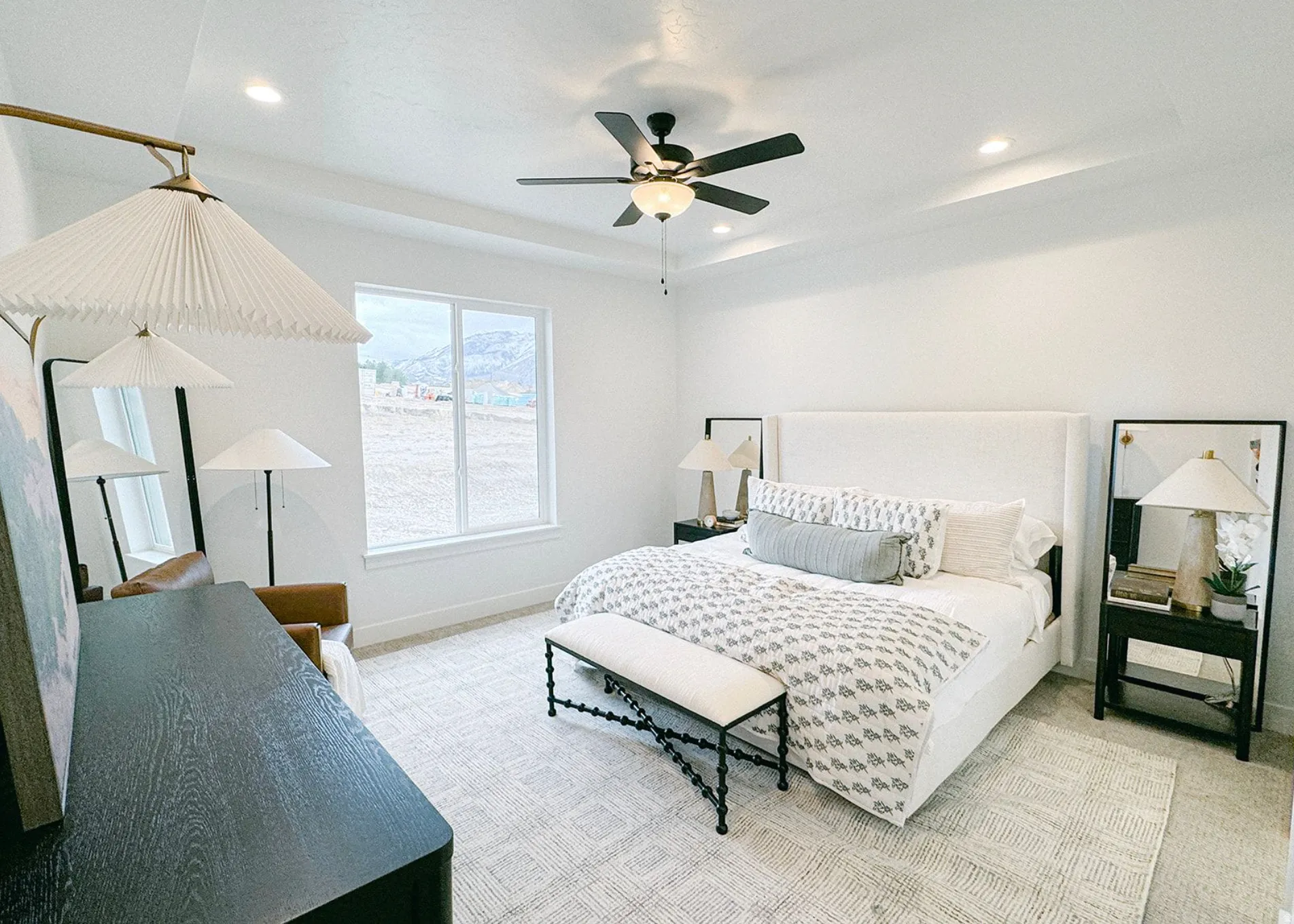Bedroom featuring ceiling fan, light carpet, a tray ceiling, and recessed lighting