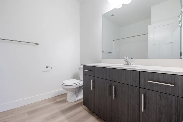 Bathroom with vanity and light wood-style floors
