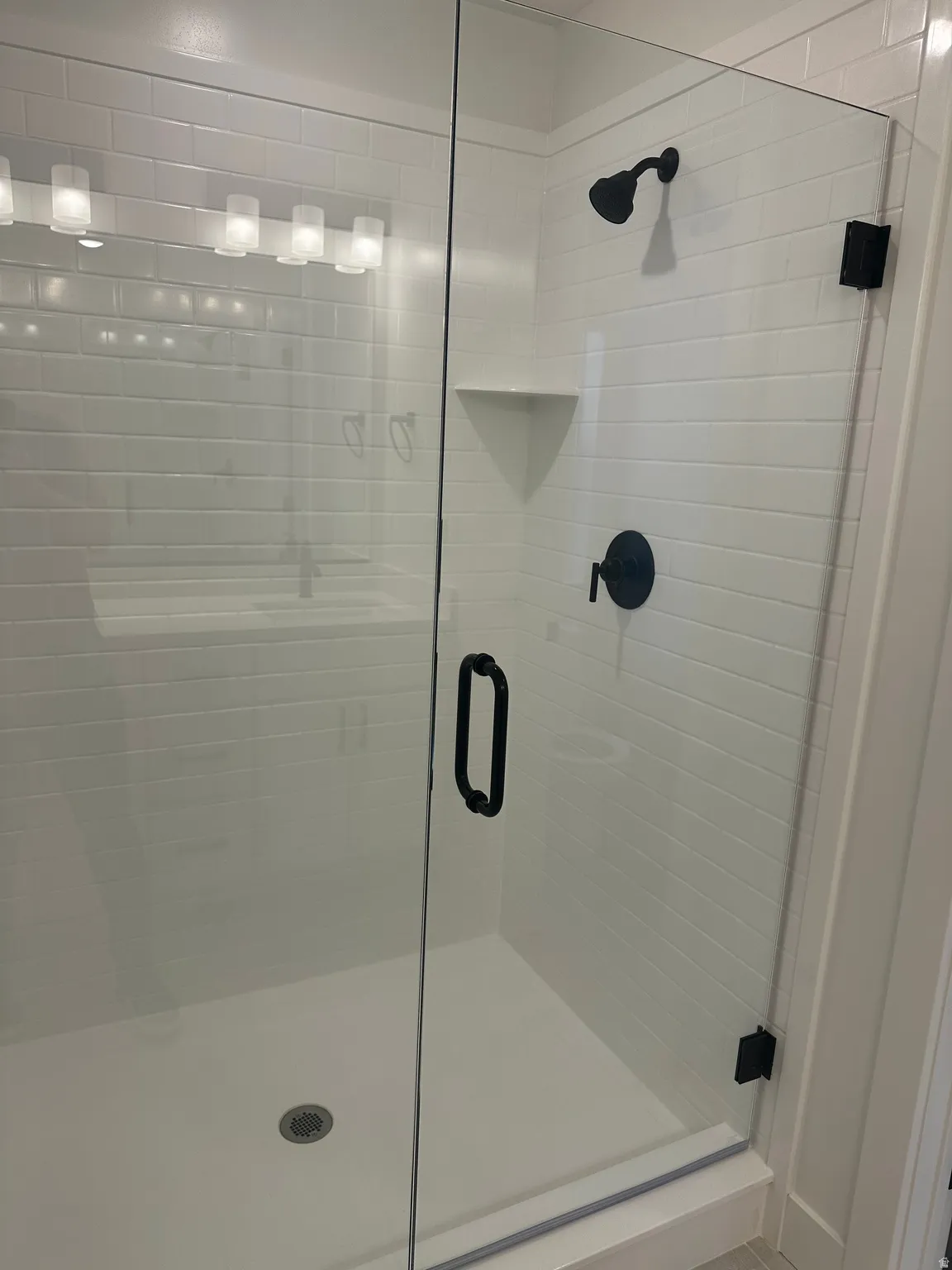 Bathroom featuring a shower stall