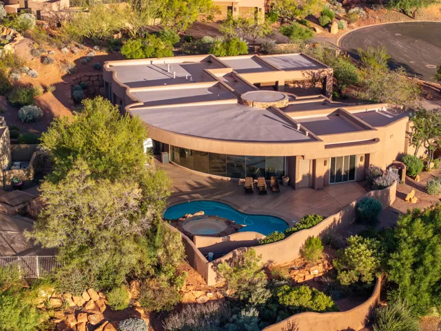 View of subject property with a pool