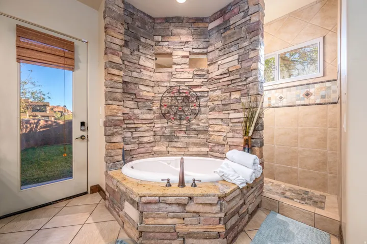 Full bathroom with a bath and tile patterned floors