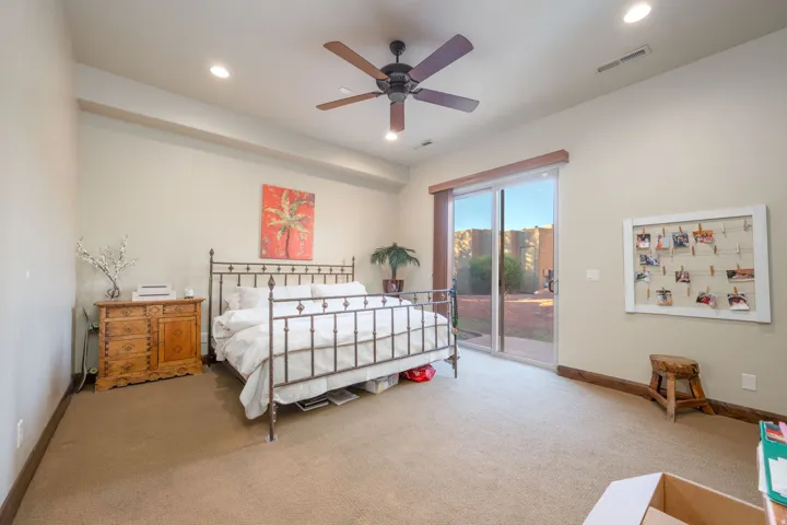 Bedroom with carpet floors, access to outside, a ceiling fan, and recessed lighting