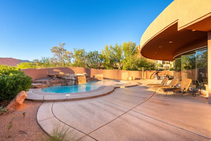 View of swimming pool featuring a patio area and a fenced backyard