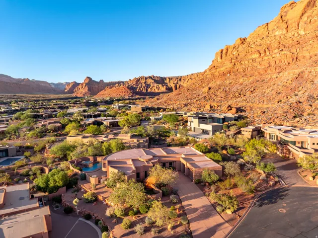 View of property location featuring a mountain backdrop and nearby suburban area