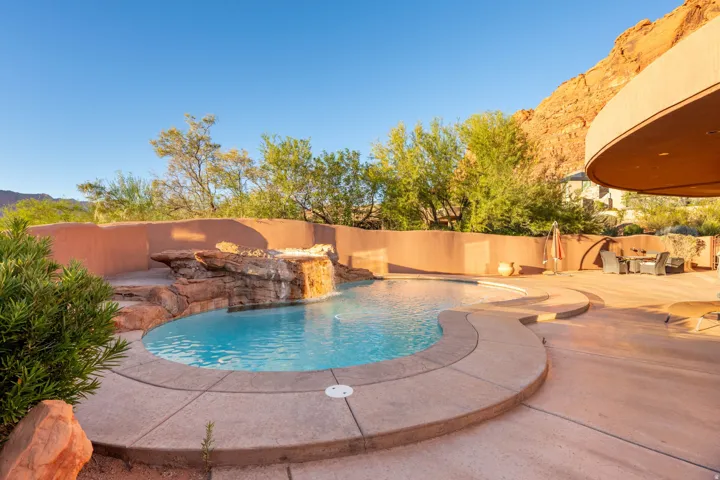 View of swimming pool featuring a patio area and a fenced backyard