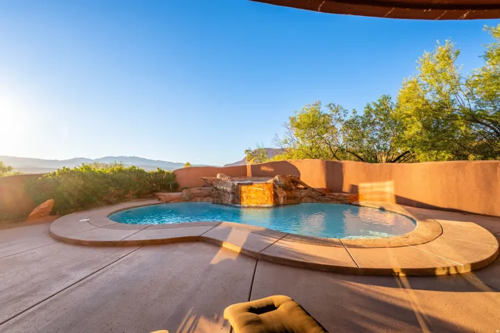 View of swimming pool featuring a patio and a mountain view
