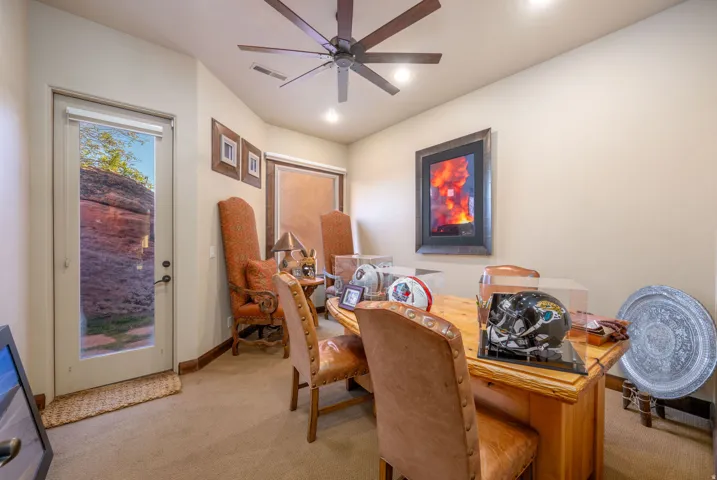 Dining space featuring light carpet, a desk, ceiling fan, and recessed lighting