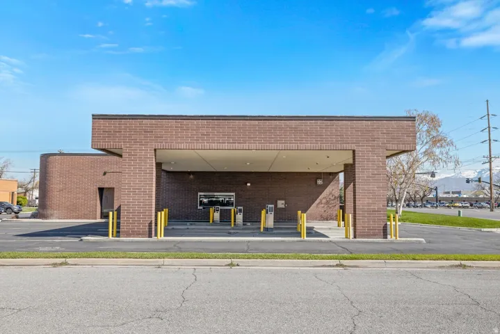 View of property featuring uncovered parking