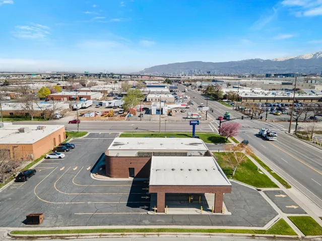 Aerial view of a mountain backdrop and industrial structures