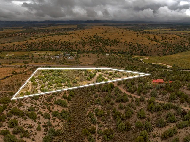 Aerial view of sparsely populated area featuring property parcel outlined and a desert landscape