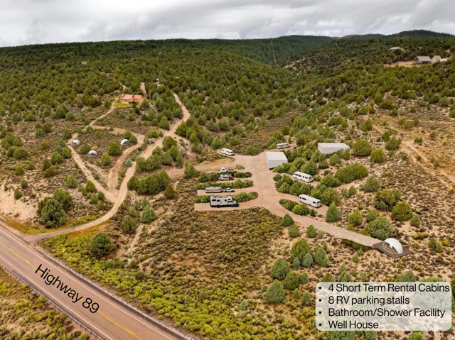 Aerial view of sparsely populated area featuring a forest