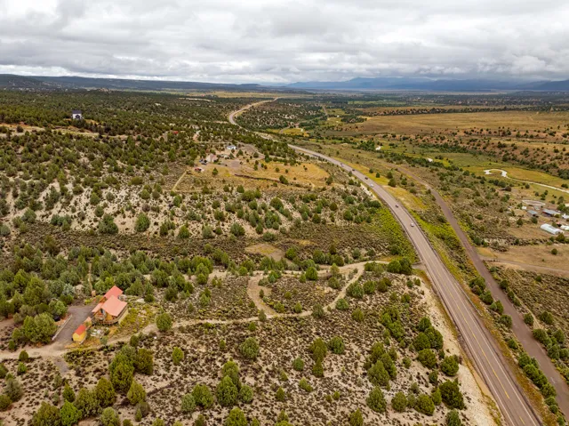 Aerial view of sparsely populated area with mountains and a desert landscape
