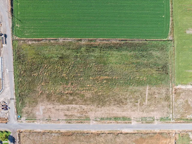 Aerial overview of property's location with rural landscape and abundant farmland