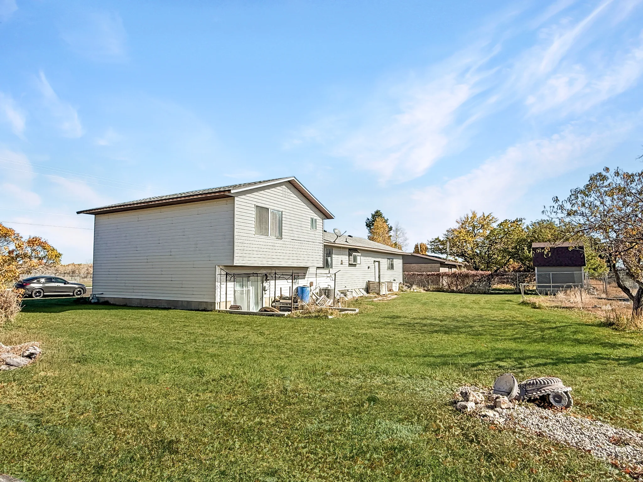 Back of house featuring a lawn