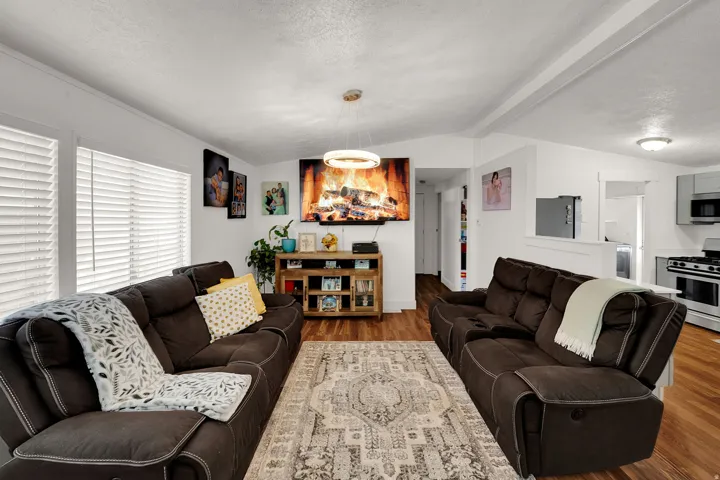 Living room featuring wood finished floors and a textured ceiling