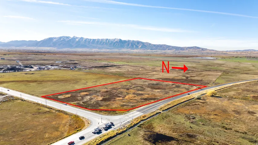 Overview of rural landscape featuring property boundaries highlighted and mountains