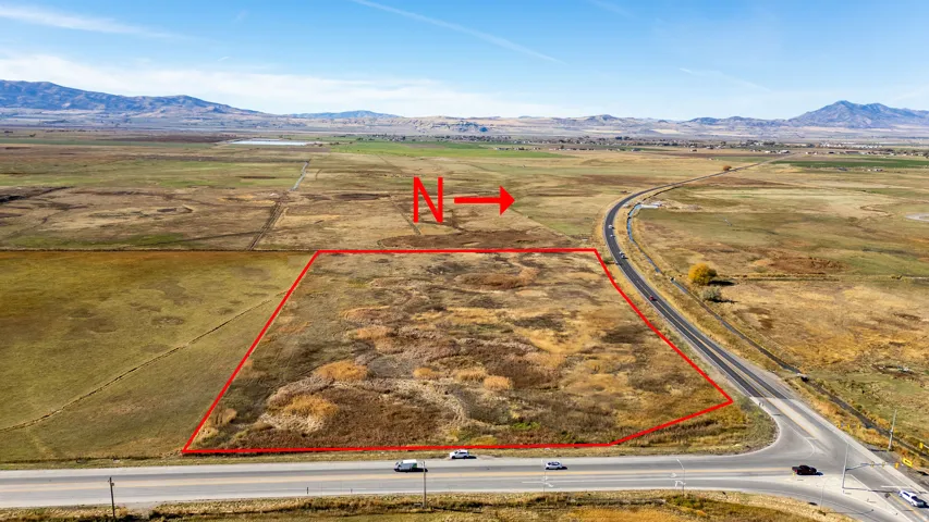 Aerial view of sparsely populated area with mountains and property boundaries highlighted