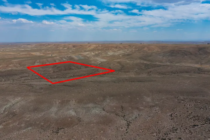 Expansive undeveloped land featuring a vast, open terrain with varied topography