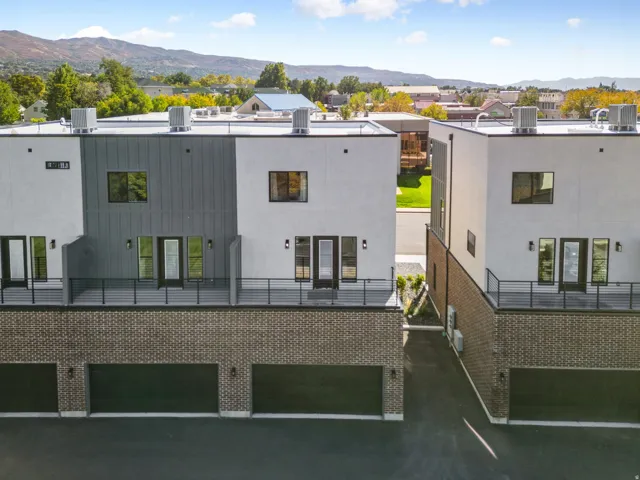 View of building exterior featuring a mountain view and a residential view