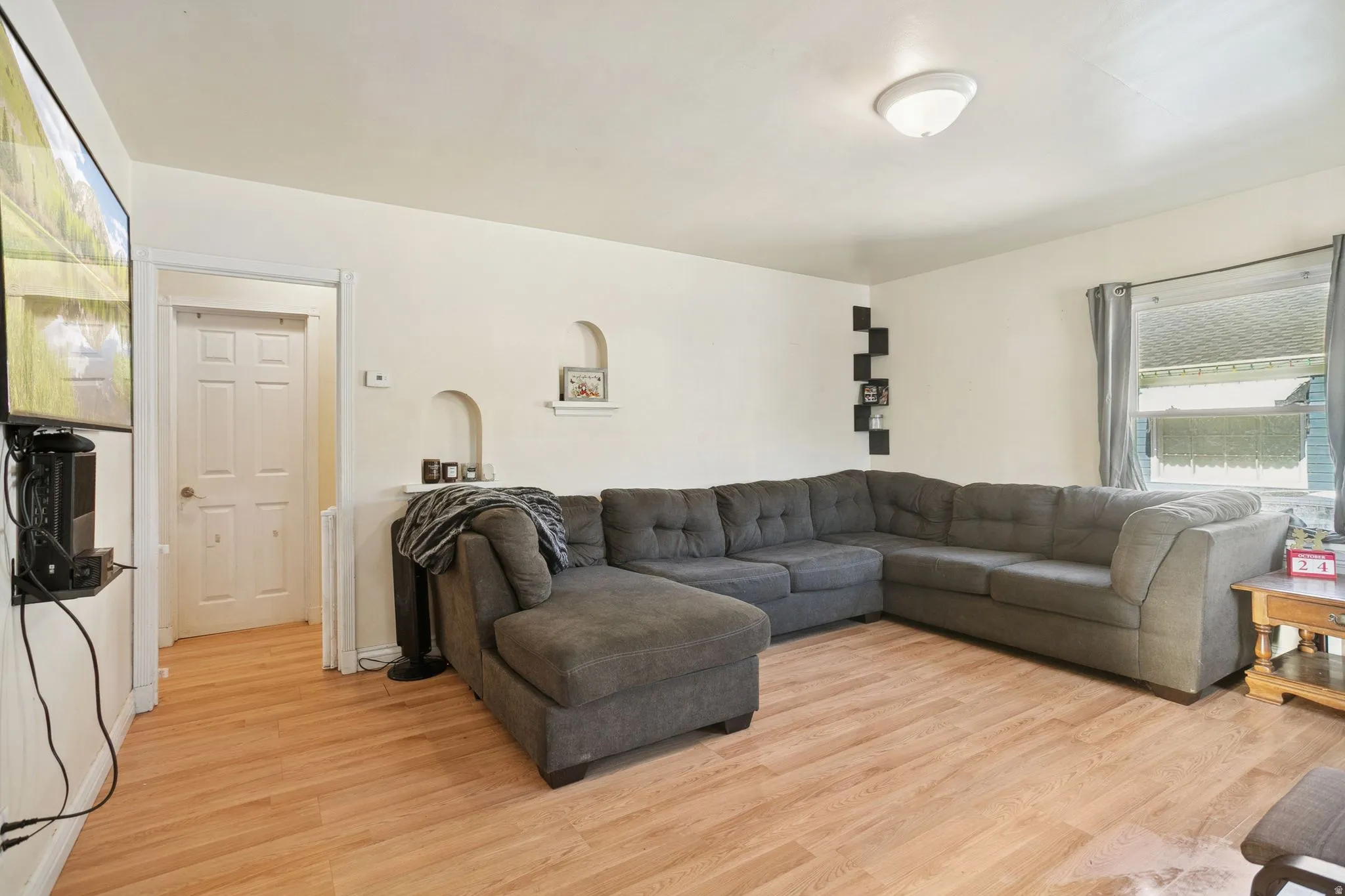 Living room with light wood-style floors