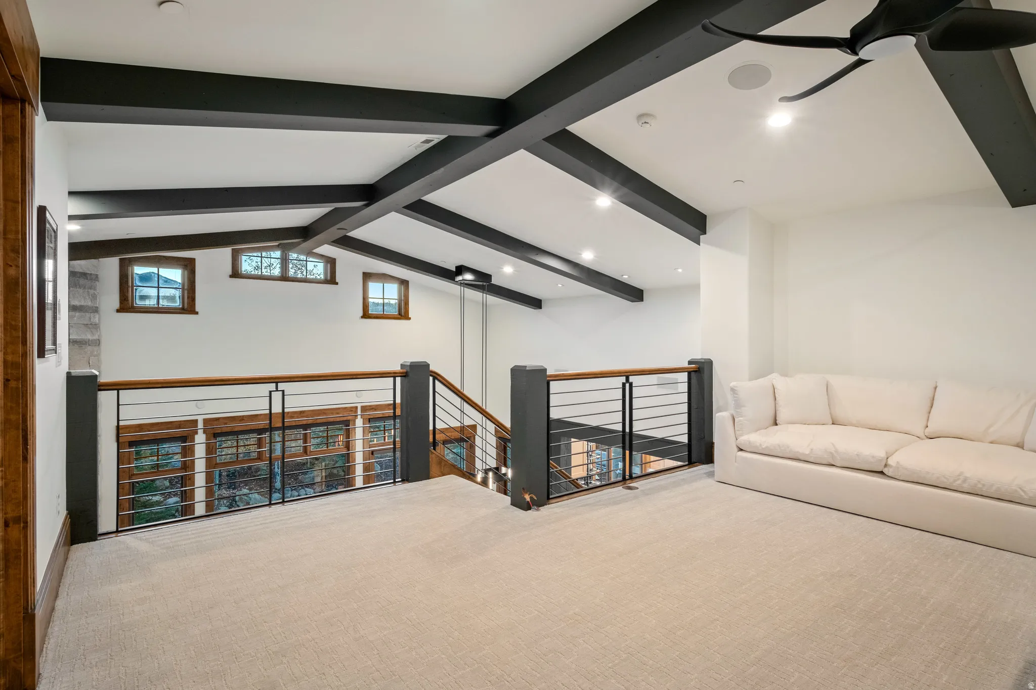 Bonus room featuring carpet, beamed ceiling, and recessed lighting