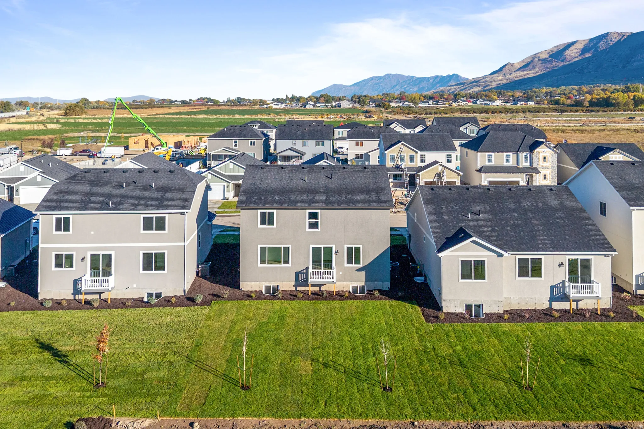 Aerial view of residential area featuring a mountainous background