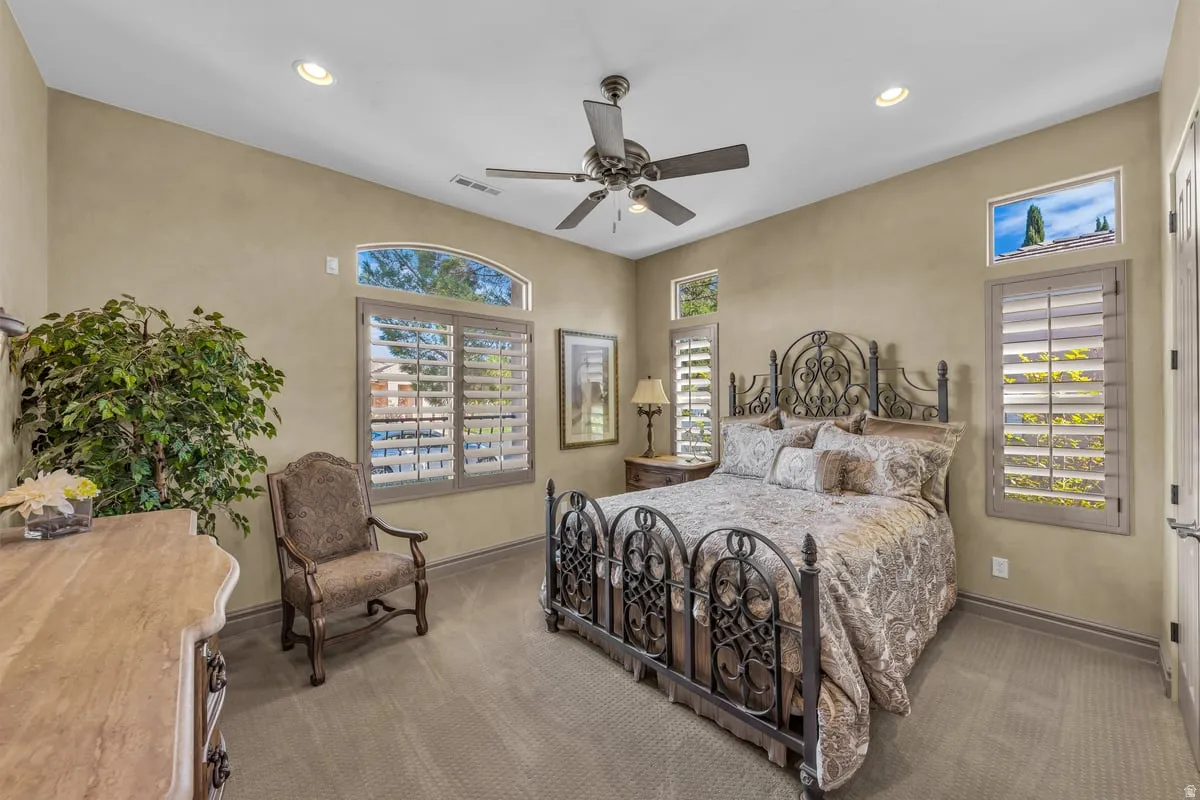 Bedroom with carpet flooring, recessed lighting, and ceiling fan