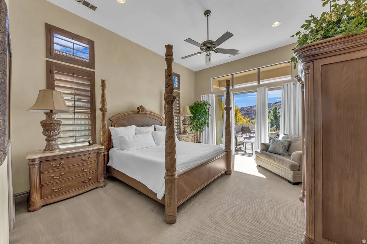 Bedroom featuring light colored carpet, access to exterior, ceiling fan, a mountain view, and recessed lighting