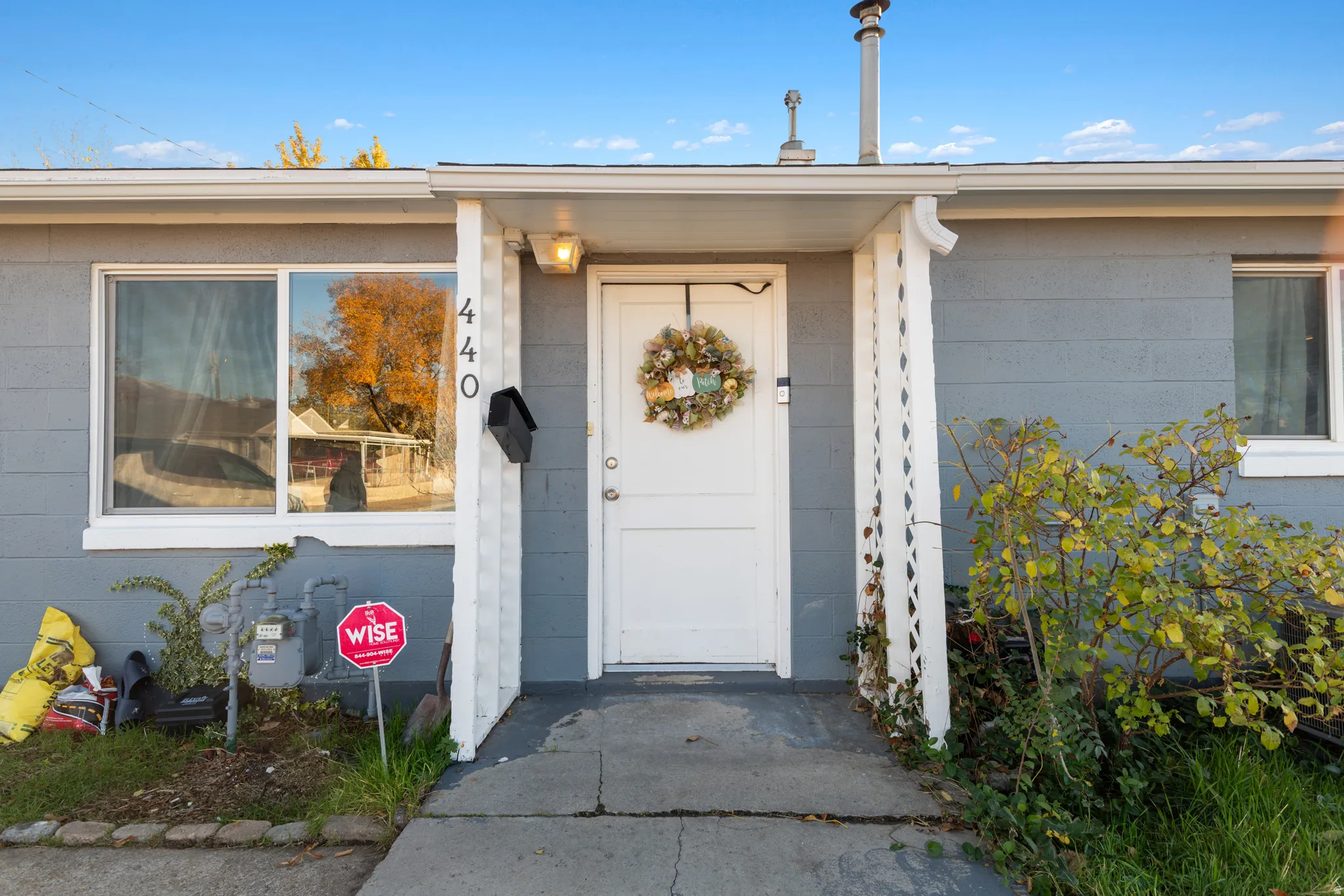 Property entrance featuring concrete block siding