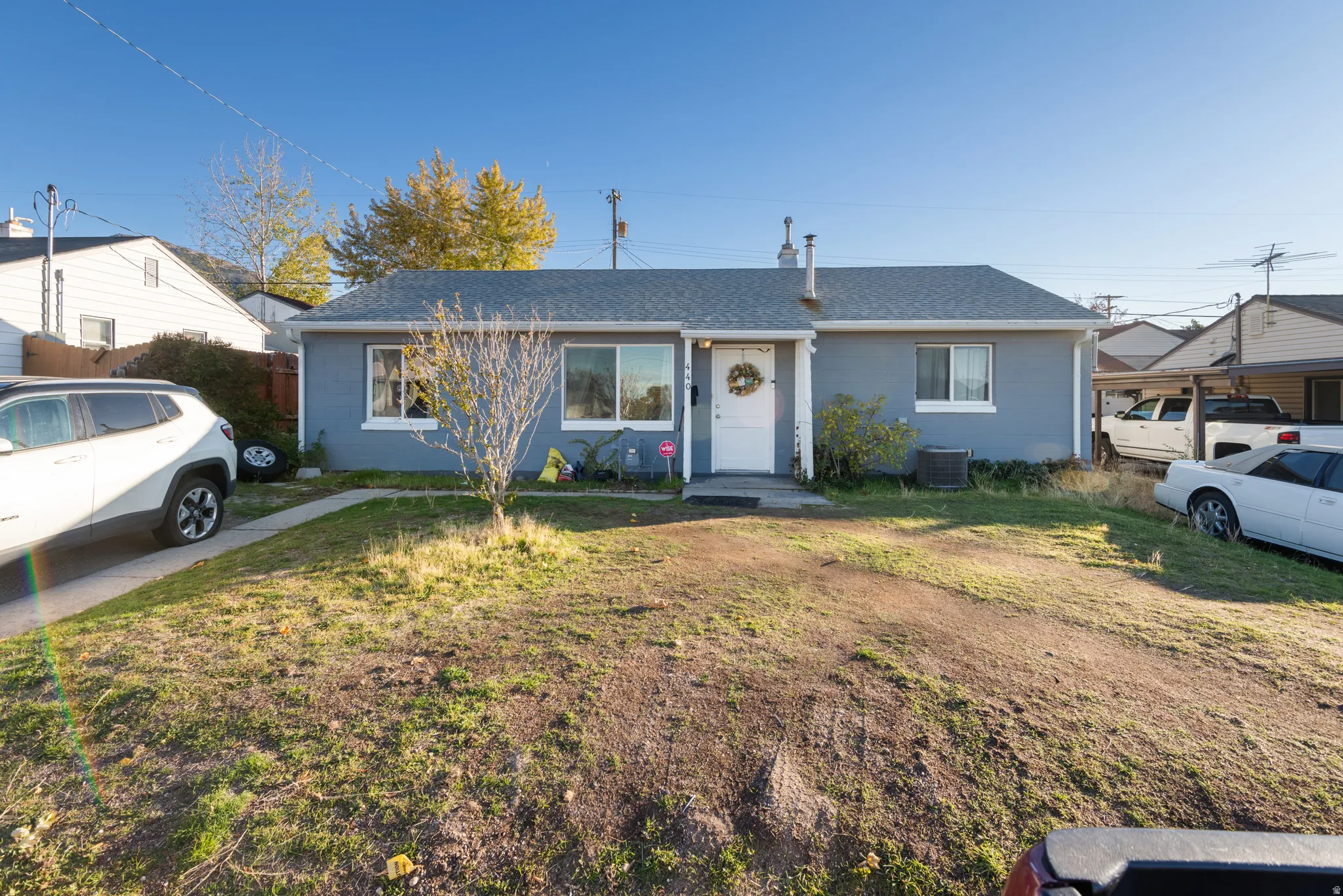 Bungalow with roof with shingles and a front yard