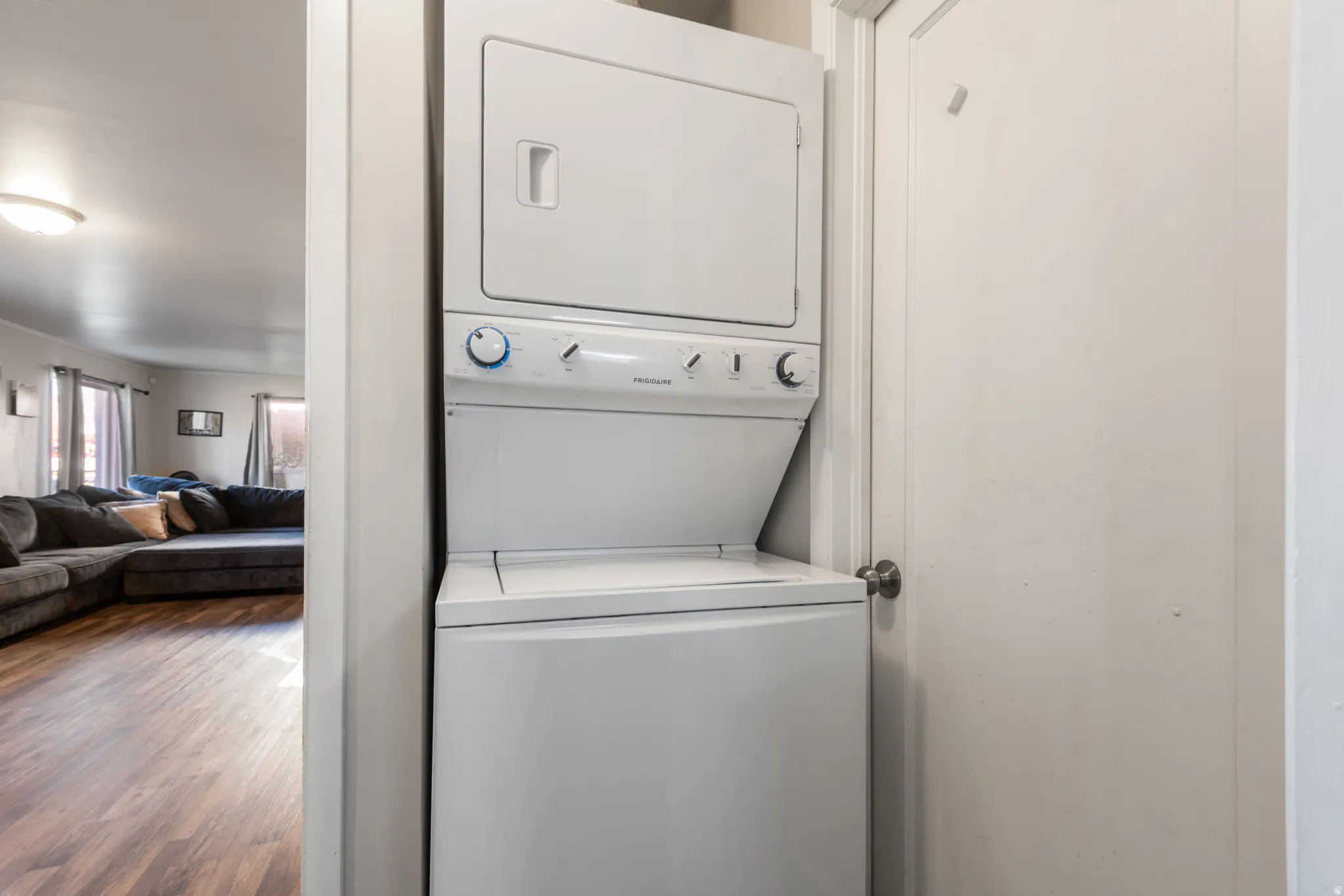 Stacked washing machine and dryer included with home