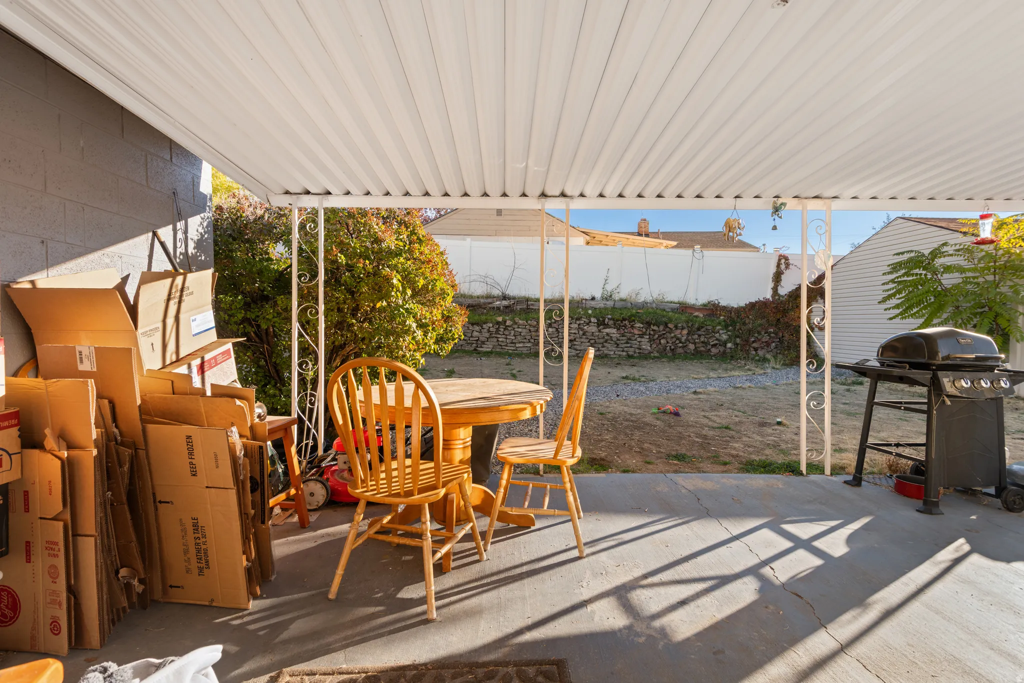 View of patio featuring grilling area, outdoor dining space.