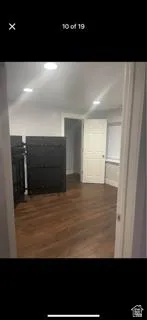 Hall with dark wood finished floors