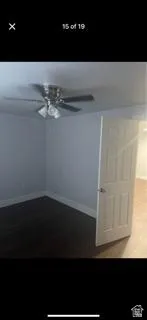 Unfurnished room featuring baseboards and a ceiling fan