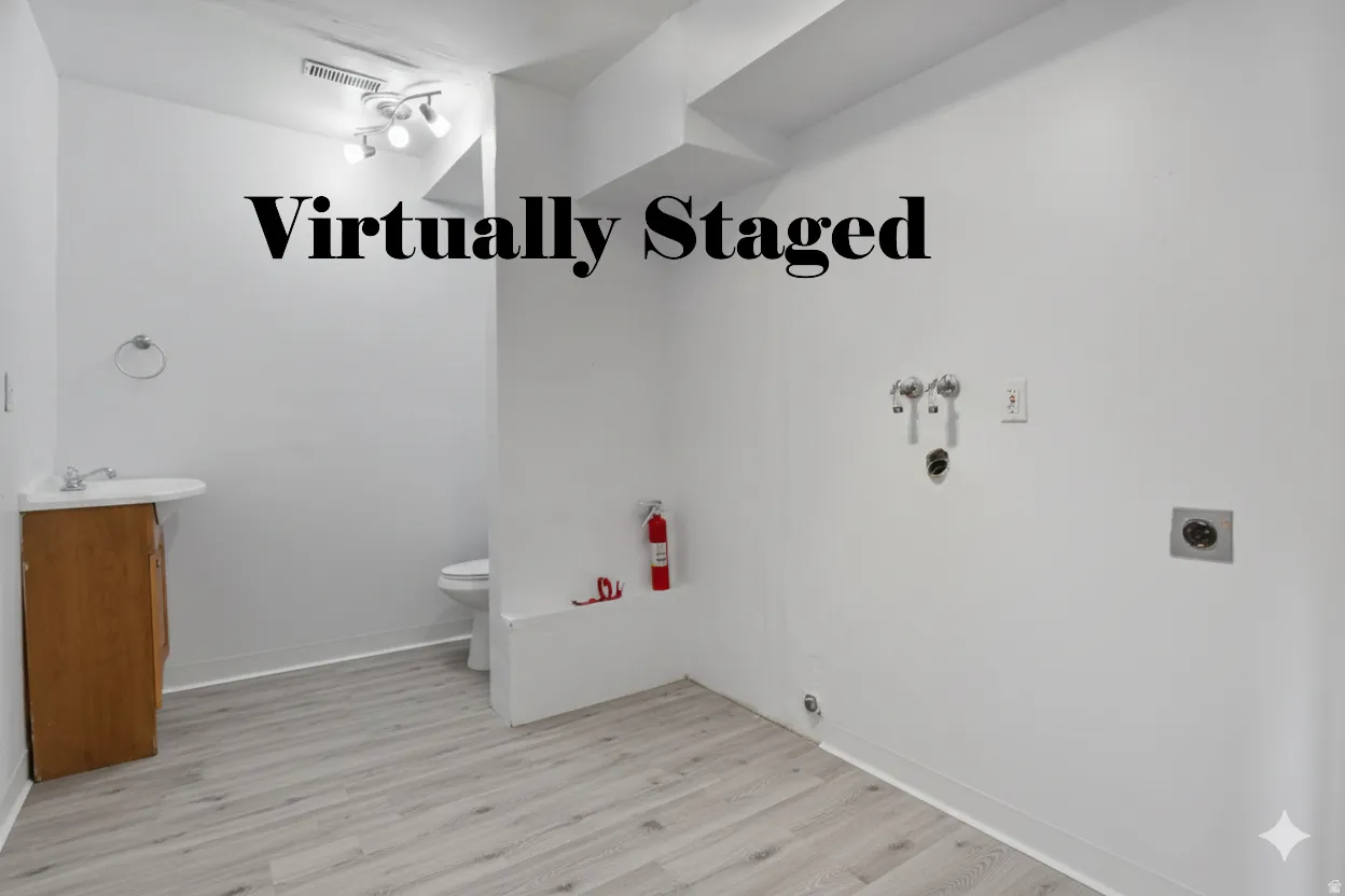 Laundry room featuring light wood finished floors, hookup for a washing machine, and electric dryer hookup