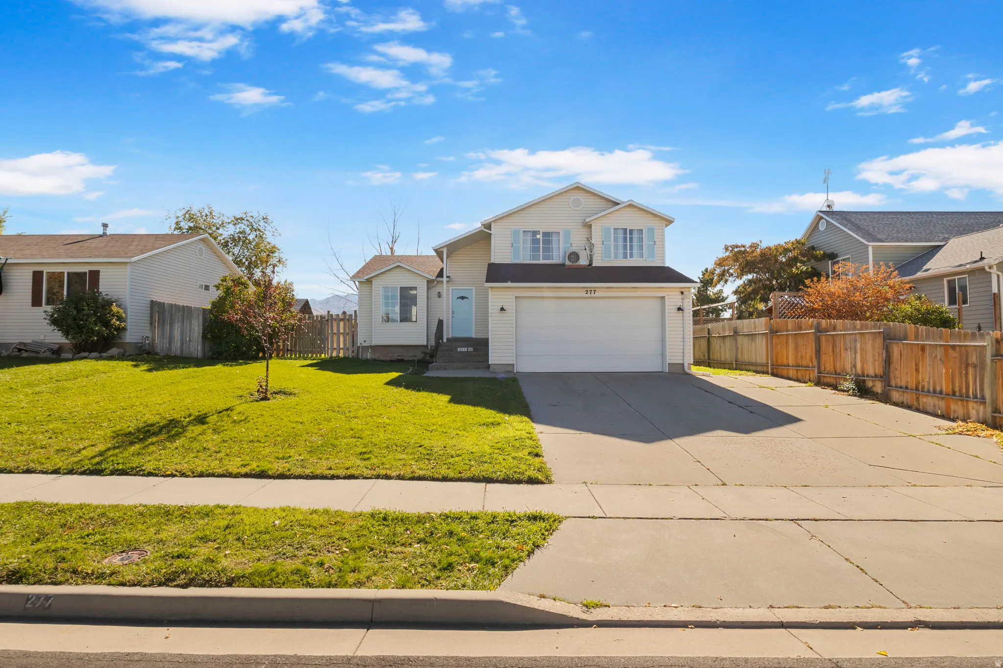 Traditional-style house with driveway and a garage