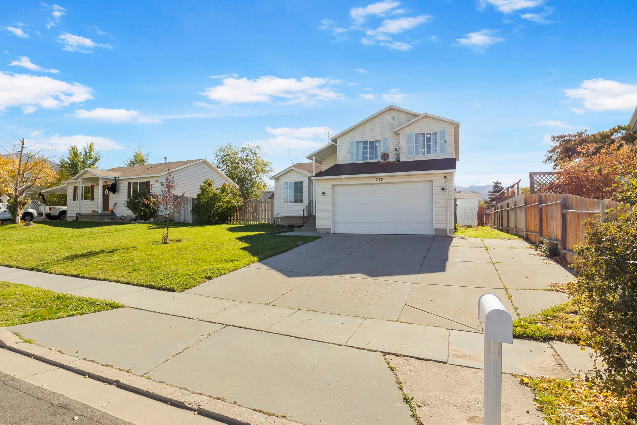 Traditional-style home with driveway and an attached garage