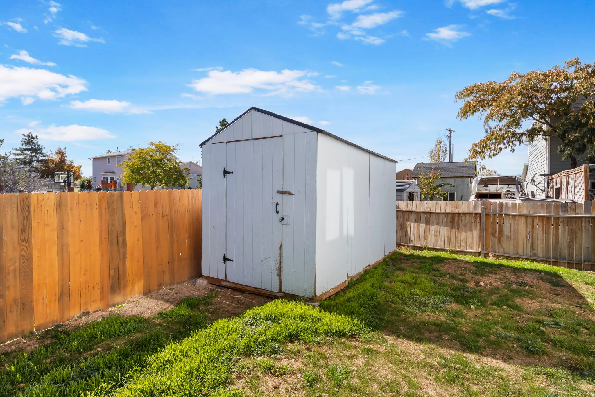 View of shed with a fenced backyard