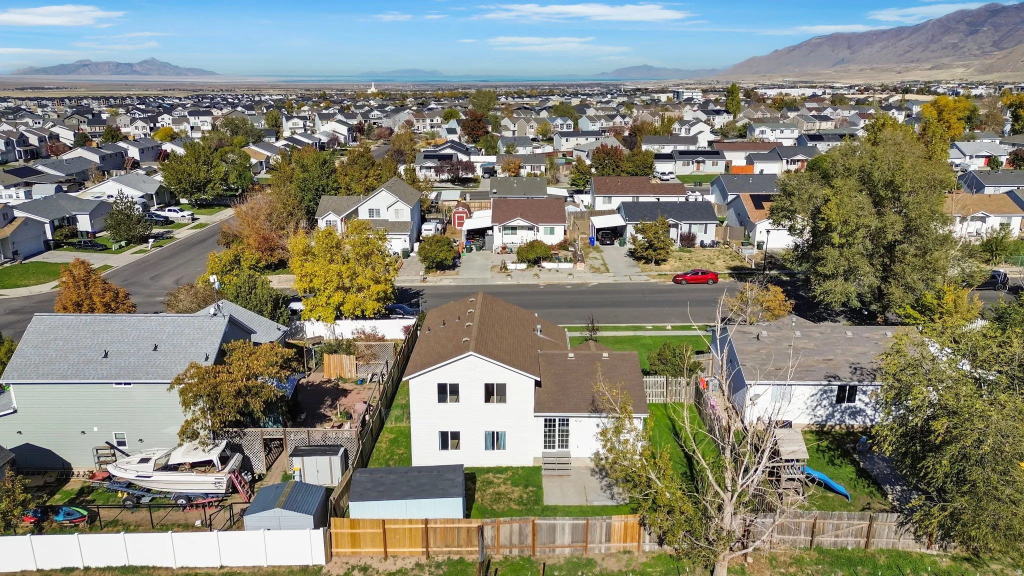 Aerial perspective of suburban area with a mountainous background