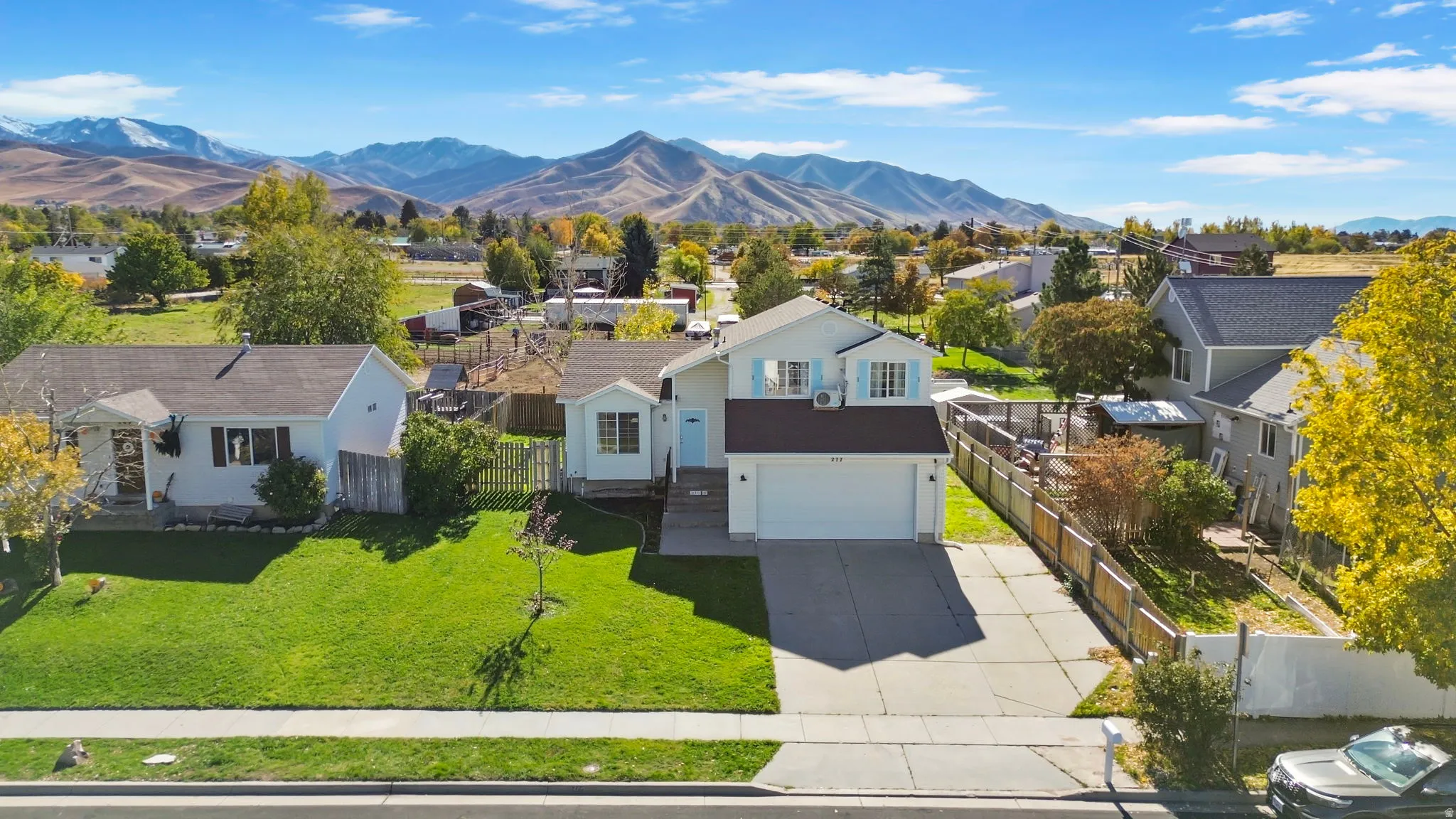 Aerial view of residential area featuring a mountain backdrop