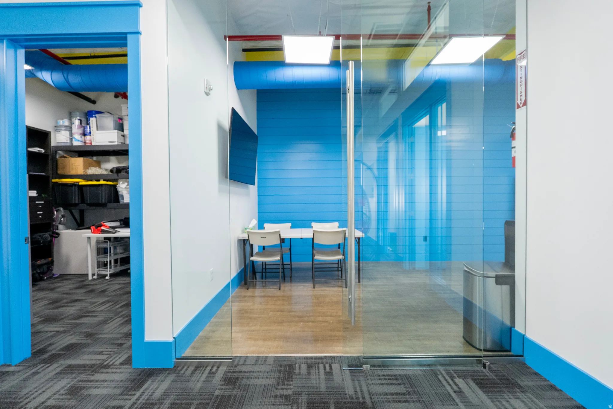 Hallway featuring dark colored carpet