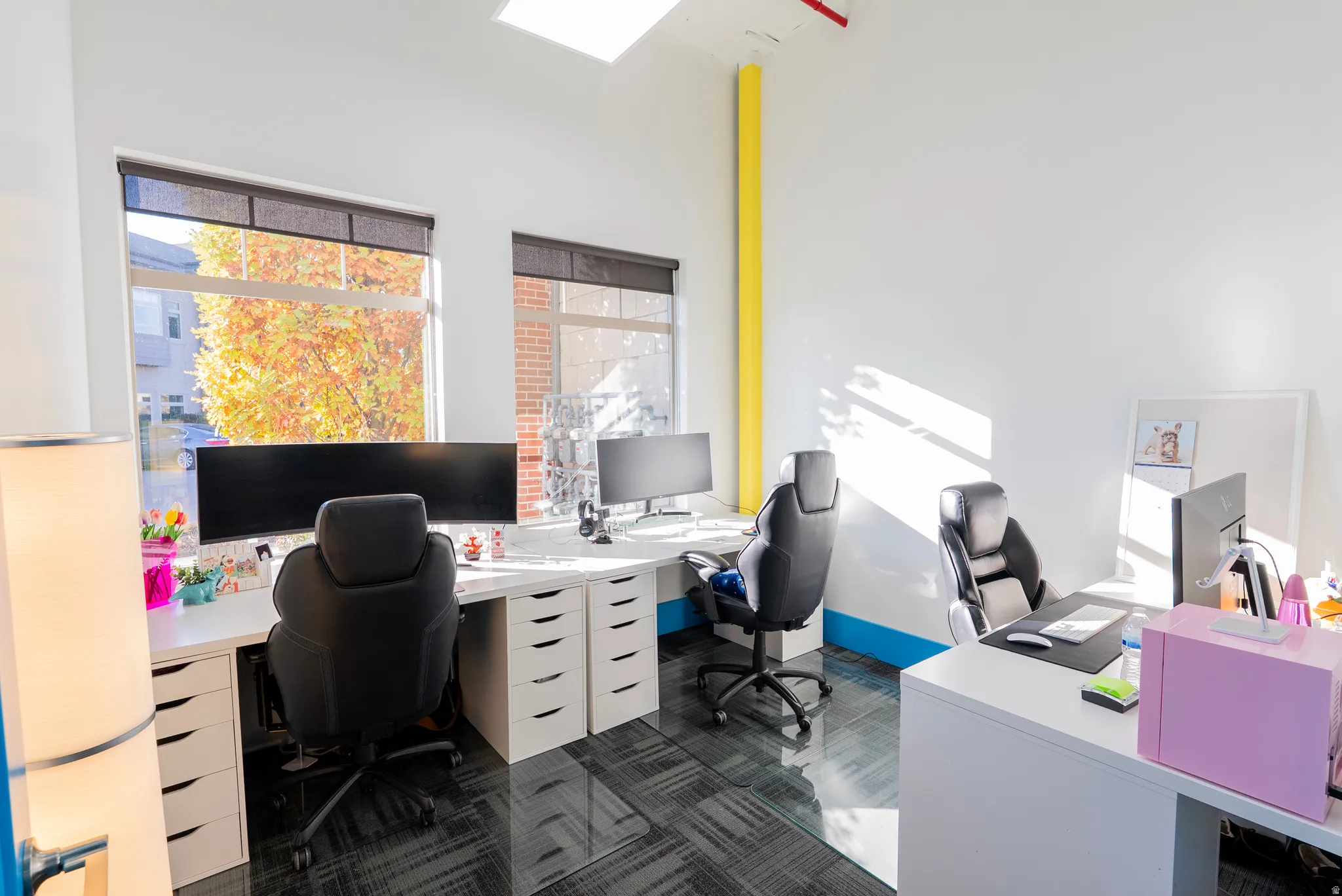 Office featuring plenty of natural light and a skylight