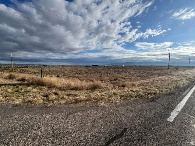 View of asphalt road with a view of countryside