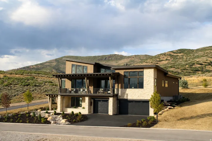 Modern architectural design featuring stone and stucco exterior