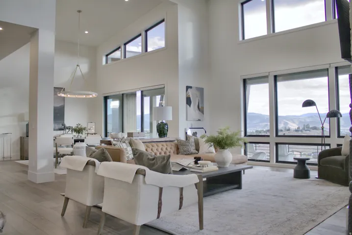 Soaring two-story living space with clerestory windows and recessed lighting throughout