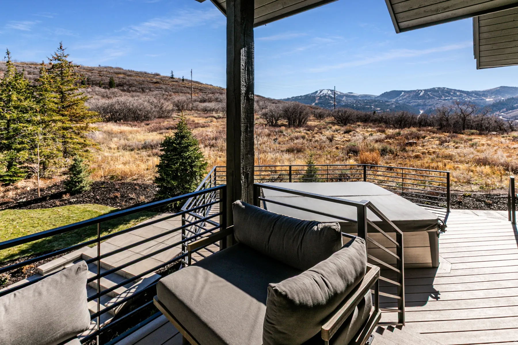 Deck with a mountain view and outdoor dining area